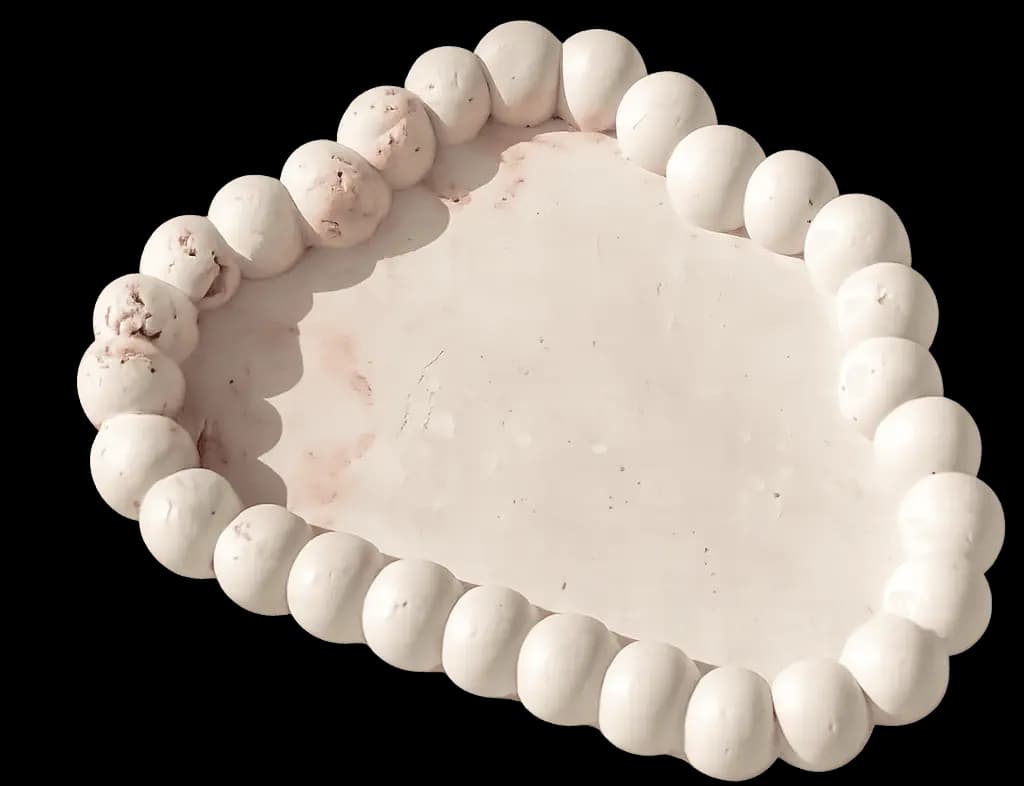 Hand-poured concrete tray with a pearl-beaded edge